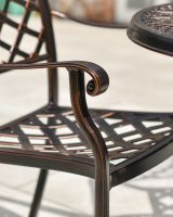Close Up of the Rolled Armrests on the Chairs