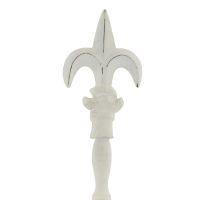 Close up of finial on antique white cake stand Close up of finial on antique white cake stand