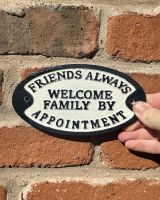 Cast iron friends always welcome wall sign