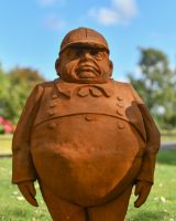 Close up of Tweedledum character garden statue Close up of Tweedledum character garden statue