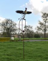 Full View of the The Large Metal Rooster Rocking Garden Spike on a Lush Green Lawn