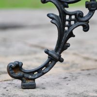 Close up of Aged Black Cast Iron "Serpent" Side Table