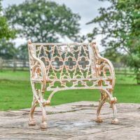 Aged Cream "Quatrefoil" Victorian Cast Iron One Seat Bench in Situ in the Garden