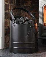 The Modern Black Coal Bucket Placed on a Carpet in Front of a Lob Burner Stove - Digital Illustration The Modern Black Coal Bucket Placed on a Carpet in Front of a Lob Burner Stove - Digital Illustration