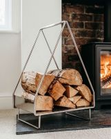The Teepee Design Log Holder next to Panelled Wall in a Traditional Living Room with a Lob Burner Stove - Digital Illustration The Teepee Design Log Holder next to Panelled Wall in a Traditional Living Room with a Lob Burner Stove - Digital Illustration