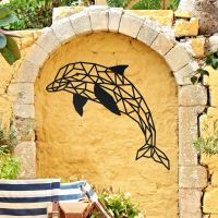 Geometric Dolphin Wall Art in Use on a Yellow Garden Wall