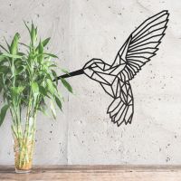 Geometric Steel Hummingbird Wall Art in Situ on a Rustic Grey Wall