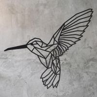 Geometric Steel Hummingbird Wall Art in on a Rustic Wall