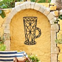 Geometric Steel Latte Glass Wall Art on a Yellow Garden Wall Geometric Steel Latte Glass Wall Art on a Yellow Garden Wall