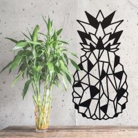 Geometric Steel Pineapple Wall Art Next to Plants