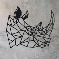 Geometric Rhino Steel Wall Art on a Rustic Wall