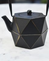Close up of Geometric Black and Gold Cast Iron Japanese Style Teapot detailing