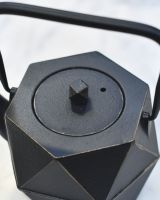 Close up of Geometric Black and Gold Cast Iron Japanese Style Teapot lid
