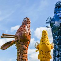 Close up of colourful metal giraffe heads Close up of colourful metal giraffe heads