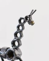 Close up of face and neck detail on scrap metal art sculpture