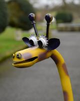 ‘Freewheeler” the Upcycled Metal Giraffe Garden Sculpture on a Tricycle close up of head