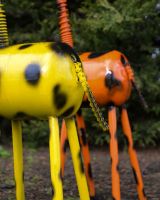 ‘Stretch’ Upcycled Gas Bottle Giraffe Garden Sculpture - Yellow close up of tail made from chain
