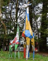 ‘Skye’ Upcycled Oil Drum Giraffe Sculpture standing with larger version