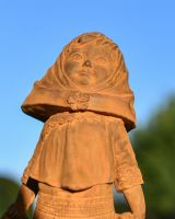 Close up of Rustic Cast Iron Girl With Basket  Close up of Rustic Cast Iron Girl With Basket