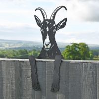 Goat Leaning Fence Topper From the Side Goat Leaning Fence Topper From the Side