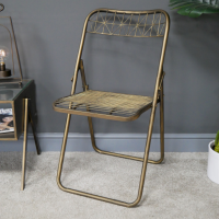 Gold Metal Wire Folding Chair in Situ Gold Metal Wire Folding Chair in Situ