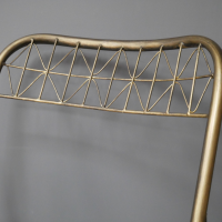 Close up of the Gold Wire Frame of the Chair Close up of the Gold Wire Frame of the Chair