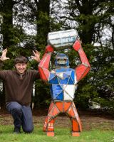 Gorilla Holding Barrel Upcycled Oil Drum Garden Sculpture with Man Crouched Next to Sculpture for Scale Gorilla Holding Barrel Upcycled Oil Drum Garden Sculpture with Man Crouched Next to Sculpture for Scale