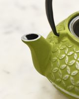 Close up of Green and Embossed Silver Teapot Spout 