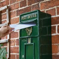 Letter Opening in Use on Green & Gold "Irish Harp" Slim Wall Mounted Post and Parcel Box Letter Opening in Use on Green & Gold "Irish Harp" Slim Wall Mounted Post and Parcel Box