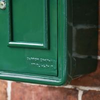 Close-Up of Finish on Green & Gold "Irish Harp" Slim Wall Mounted Post and Parcel Box Close-Up of Finish on Green & Gold "Irish Harp" Slim Wall Mounted Post and Parcel Box