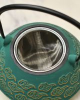 Close up of tea strainer detail on Green & Gold Uwade Style Teapot with Cloud Detailing