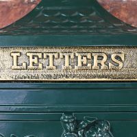 Brass Letter Flap on the Front of the Wall Mounted Post Box