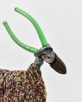 Close up of face detail on recycled metal art sculpture