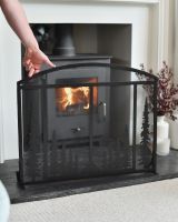 Scale image of black ornate fire screen