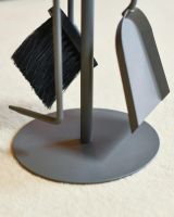 Close Up Of Grey Contemporary Circular Three Piece Companion Set with Wooden Handles Base