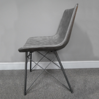 View of the Side of the Grey Leather Dining Chair