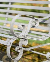 curved arms on grey rustic bench 