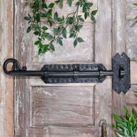 Grimoire Door Bolt in Situ on a rustic Wooden Door