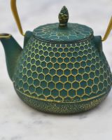 Close up of "Hachi" Green and Gold Cast Iron Japanese Style Teapot detailing