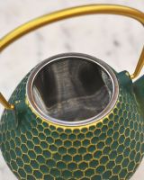 Close up of "Hachi" Green and Gold Cast Iron Japanese Style Teapot strainer