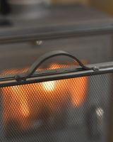 Handle On The Black Steel Fire Guard Handle On The Black Steel Fire Guard