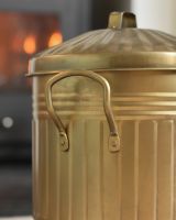 Close Up Of The Handle On The Gold Log Basket Close Up Of The Handle On The Gold Log Basket