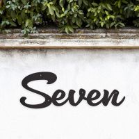 Black Handwritten House Number Sign on Garden Wall