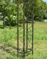 Close up of intricate detail on legs of garden rose arch Close up of intricate detail on legs of garden rose arch