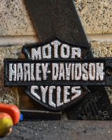 Close up of Harley Davidson Garage Vintage Style Cast Iron Sign finish Close up of Harley Davidson Garage Vintage Style Cast Iron Sign finish