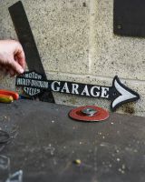 Scale image of Harley Davidson Garage Vintage Style Cast Iron Sign Scale image of Harley Davidson Garage Vintage Style Cast Iron Sign