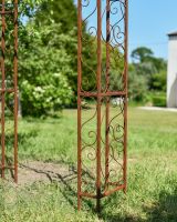 Close up of ornate leg detail on rose arch Close up of ornate leg detail on rose arch