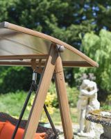 Close up of moveable shaded roof detail on patio swing seat Close up of moveable shaded roof detail on patio swing seat