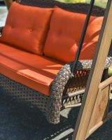 Close up of burnt orange and mocha coloured swing seat Close up of burnt orange and mocha coloured swing seat