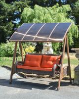 View of shaded swing seat with moveable roof View of shaded swing seat with moveable roof